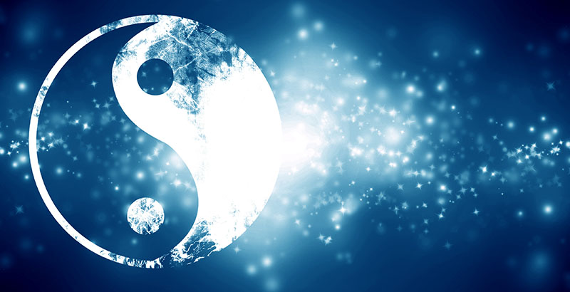 yin yang sign on a dark blue background