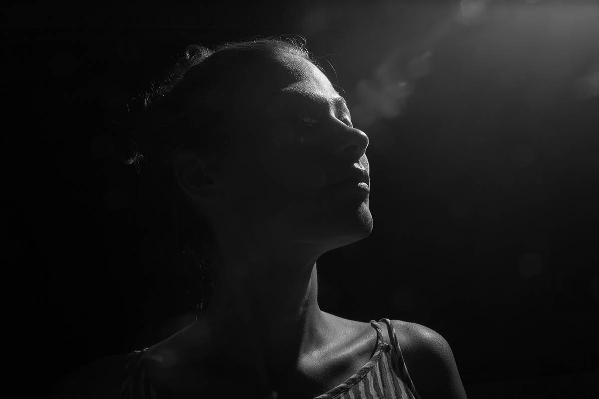 Hidden face in the shadow.Female silhouette.